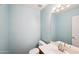 Small bathroom with light blue walls and a single sink vanity at 7869 W Kristal Way, Glendale, AZ 85308