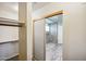 View of a bathroom with a shower and closet at 7869 W Kristal Way, Glendale, AZ 85308