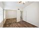 Bedroom with mirrored closet doors and wood-look floors at 7869 W Kristal Way, Glendale, AZ 85308