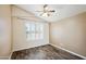 Bedroom with wood-look floors, plantation shutters and ceiling fan at 7869 W Kristal Way, Glendale, AZ 85308