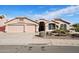 Beautiful stucco home with two-car garage and desert landscaping at 7869 W Kristal Way, Glendale, AZ 85308