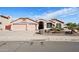 House exterior with two-car garage and front yard landscaping at 7869 W Kristal Way, Glendale, AZ 85308