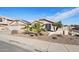 Two-story home with desert landscaping and a two-car garage at 7869 W Kristal Way, Glendale, AZ 85308