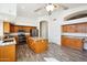 Modern kitchen with island, granite countertops, and stainless steel appliances at 7869 W Kristal Way, Glendale, AZ 85308
