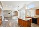 Spacious kitchen with island, granite countertops, and stainless steel appliances at 7869 W Kristal Way, Glendale, AZ 85308