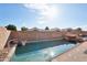 Inviting backyard pool with a rock waterfall feature at 7869 W Kristal Way, Glendale, AZ 85308