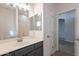 Bathroom with single vanity, mirror, and access to the bedroom at 818 W Allen St, Phoenix, AZ 85041