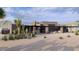 Backyard view of a contemporary home with covered patio and desert landscaping at 9235 E Vista Dr, Scottsdale, AZ 85262