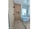 Modern bathroom featuring walk-in shower, soaking tub, wood-look tile floor, and neutral color palette at 947 N Warner Dr, Apache Junction, AZ 85120