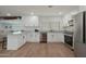 Updated kitchen featuring white shaker cabinets and granite countertops at 9529 N 34Th Ln, Phoenix, AZ 85051