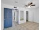 Bedroom with mirrored closet and blue door at 10329 W Griswold Rd, Peoria, AZ 85345