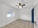 Bedroom with ceiling fan and tile floors at 10329 W Griswold Rd, Peoria, AZ 85345