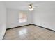 Bright bedroom with tile floors and ceiling fan at 10329 W Griswold Rd, Peoria, AZ 85345