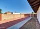 Side yard with brick pavers and gated access at 10329 W Griswold Rd, Peoria, AZ 85345