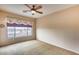 Spacious bedroom with a view and ceiling fan at 11022 N Indigo Dr # 127, Fountain Hills, AZ 85268