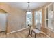 Bright dining area with wood floors and plantation shutters at 11022 N Indigo Dr # 127, Fountain Hills, AZ 85268