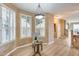 Sunlit dining area featuring plantation shutters and wood floors at 11022 N Indigo Dr # 127, Fountain Hills, AZ 85268