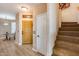 Light and bright entryway with wood floors and staircase at 11022 N Indigo Dr # 127, Fountain Hills, AZ 85268