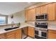 Stainless steel appliances and granite countertops in kitchen at 11022 N Indigo Dr # 127, Fountain Hills, AZ 85268