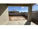 Covered back patio overlooking a spacious backyard with block wall for privacy at 11453 E Utah Ave, Mesa, AZ 85212