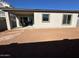 Large backyard with covered patio and unlandscaped area at 11453 E Utah Ave, Mesa, AZ 85212