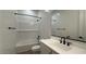 Bathroom featuring a shower-tub combo, a sink, and modern fixtures at 11453 E Utah Ave, Mesa, AZ 85212