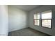 Bedroom featuring carpet and a wall of two windows that provide natural light at 11453 E Utah Ave, Mesa, AZ 85212