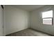 Bedroom featuring carpet, closet, and a wall of window that provide natural light at 11453 E Utah Ave, Mesa, AZ 85212