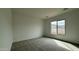 Bedroom with natural light, plush carpeting, and ample space at 11453 E Utah Ave, Mesa, AZ 85212