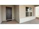 Welcoming front entry showcasing a stylish door and adjacent windows for natural light at 11453 E Utah Ave, Mesa, AZ 85212