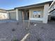 Landscaped front yard with gravel and two young trees at 11453 E Utah Ave, Mesa, AZ 85212