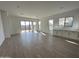 Spacious great room with tile floors and sliding glass doors at 11453 E Utah Ave, Mesa, AZ 85212