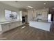 Modern kitchen with white cabinets, quartz countertops, and an island at 11453 E Utah Ave, Mesa, AZ 85212