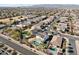 Aerial view showing a house with a pool and solar panels, located in a residential area at 12053 N 157Th Ave, Surprise, AZ 85379