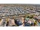 Aerial view showcasing a house with solar panels and a pool, situated within a well-established neighborhood at 12053 N 157Th Ave, Surprise, AZ 85379