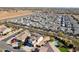 Aerial view of a house with solar panels and a pool in a residential neighborhood at 12053 N 157Th Ave, Surprise, AZ 85379