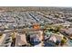 Aerial view of a house with solar panels in a neighborhood with a large field nearby at 12053 N 157Th Ave, Surprise, AZ 85379