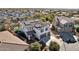 Aerial view of a two-story house with solar panels, a pool, and a large backyard in a residential neighborhood at 12053 N 157Th Ave, Surprise, AZ 85379