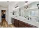 Elegant bathroom features double vanity, walk-in shower, and soaking tub at 12053 N 157Th Ave, Surprise, AZ 85379