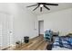 Simple bedroom with wood-look floors and a ceiling fan at 12053 N 157Th Ave, Surprise, AZ 85379