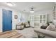 Entryway with light flooring, a blue door, and a built-in shelving unit at 12053 N 157Th Ave, Surprise, AZ 85379