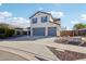 Two-story house with a three-car garage at 12053 N 157Th Ave, Surprise, AZ 85379