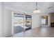 Bright dining room with sliding glass door to patio at 12234 S Shoshoni Dr, Phoenix, AZ 85044