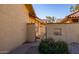 Private gated side entrance with pathway leading to the home at 12234 S Shoshoni Dr, Phoenix, AZ 85044