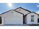 Newly constructed home with white exterior, brown roof, and a two-car garage at 13165 E Verbina Ln, Florence, AZ 85132