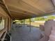 Long view of backyard with covered patio and grassy area at 1324 W Bethany Home Rd, Phoenix, AZ 85013