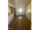 Bright bedroom with hardwood floors and built-in shelves at 1324 W Bethany Home Rd, Phoenix, AZ 85013