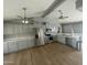 Spacious kitchen with gray cabinets, stainless steel appliances and hardwood floors at 1324 W Bethany Home Rd, Phoenix, AZ 85013