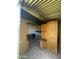 Interior of cluttered storage shed with wooden furniture at 1324 W Bethany Home Rd, Phoenix, AZ 85013