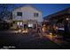 Nighttime view of backyard featuring a barbecue area, spa, and string lights at 1340 S 232Nd Ave, Buckeye, AZ 85326